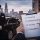 Checklist for choosing a professional chauffeur service in Chicago with chauffeur and black luxury sedan in background