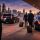 Multiple executives arriving in Chicago with chauffeur transportation, black luxury sedan and SUV